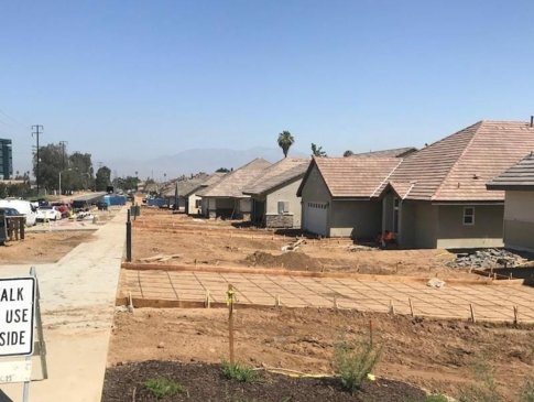 neighborhood homes with the roofs completed